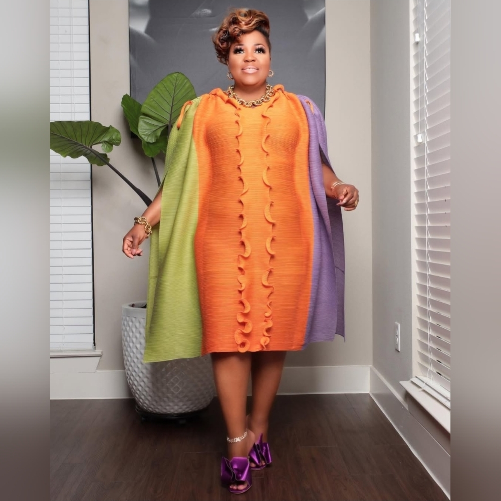 Vibrant Orange Dress with Green and Purple Cape